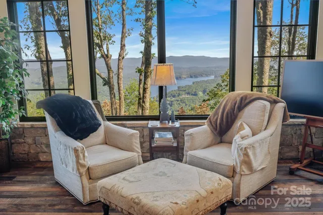a kitchen that has a lot of cabinets in it and wooden floors
