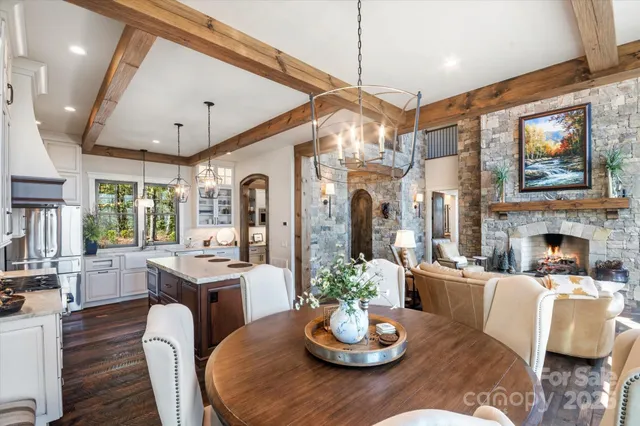 a kitchen with stainless steel appliances granite countertop a stove and a wooden floors
