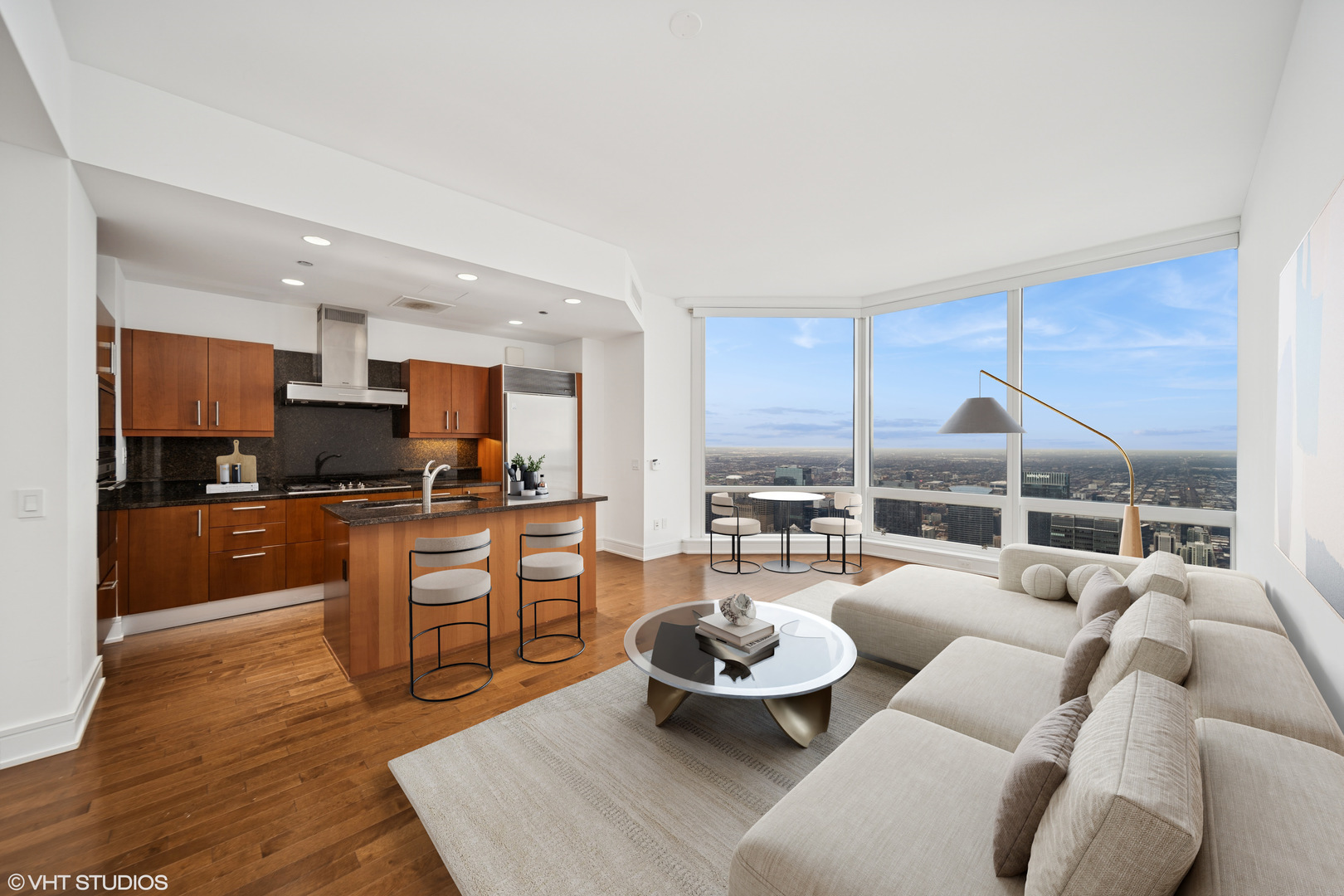 401 North Wabash Avenue, Unit 78G Chicago, IL 60611 - Photo 5 of 27 a kitchen with stainless steel appliances kitchen island granite countertop a sink and white cabinets