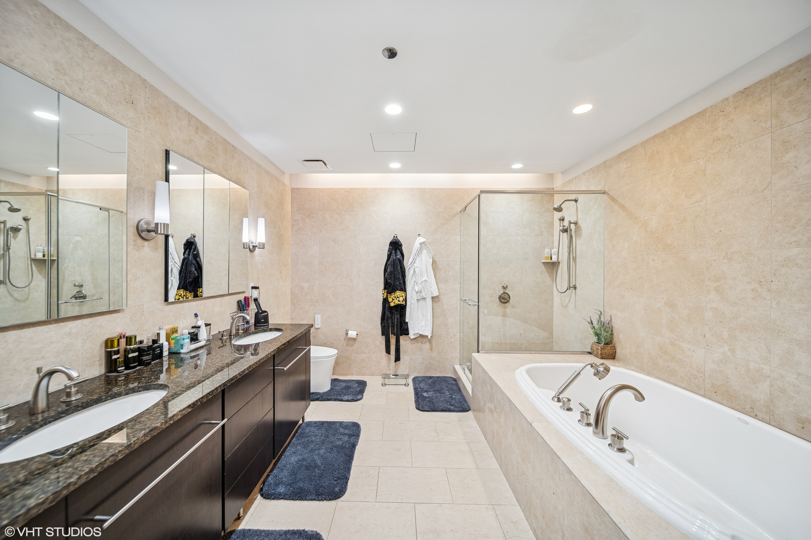 401 North Wabash Avenue, Unit 78G Chicago, IL 60611 - Photo 7 of 27 a large bathroom with a tub a double vanity sink and mirror