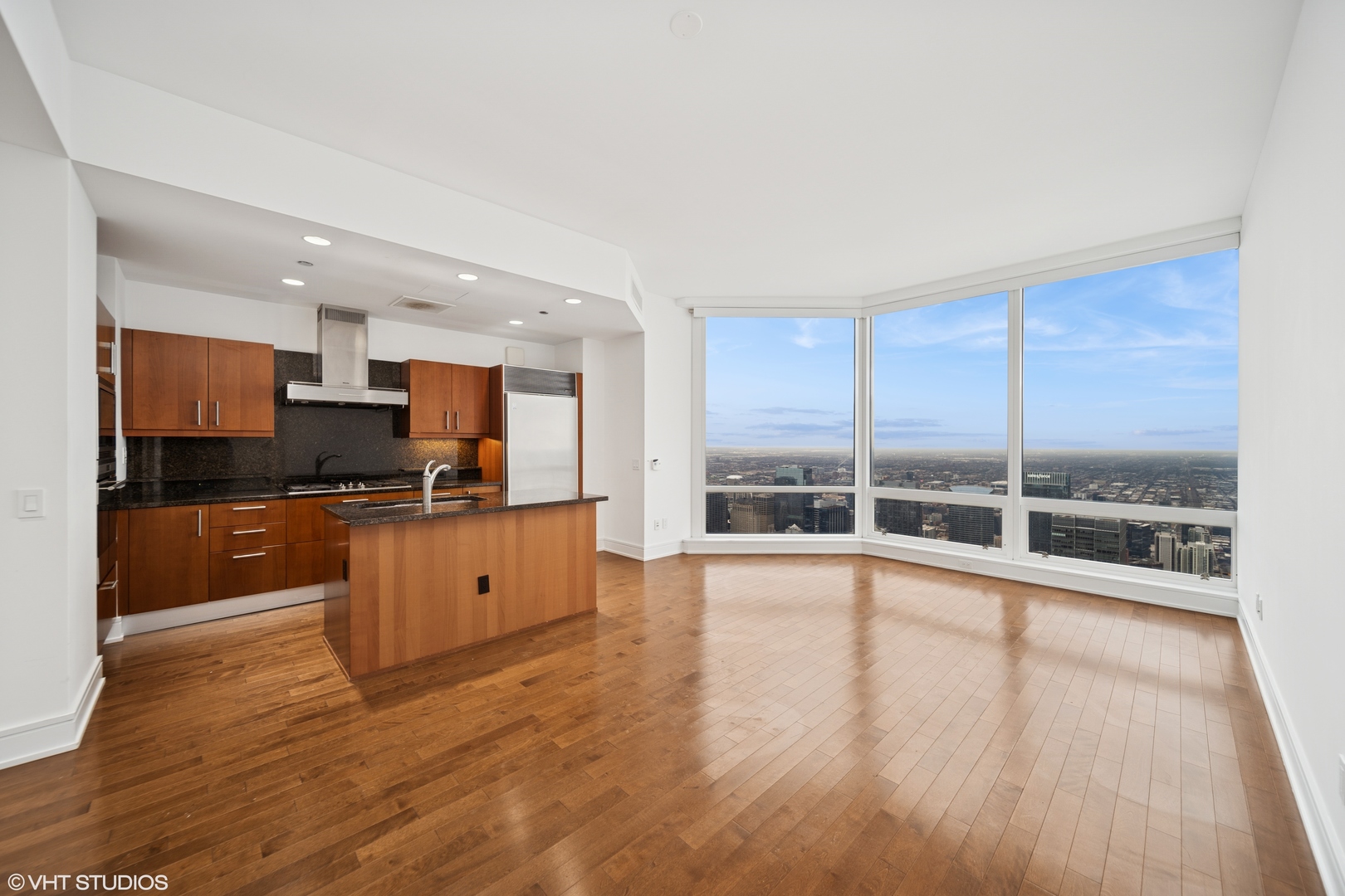 401 North Wabash Avenue, Unit 78G Chicago, IL 60611 - Photo 8 of 27 a large kitchen with stainless steel appliances granite countertop a large window and a counter top space