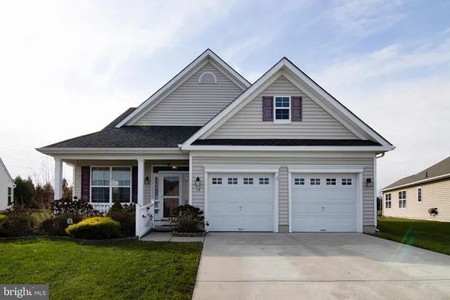 a view of a house with garden and porch
