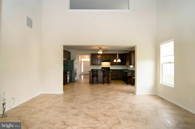 a view of empty room with a flat screen tv