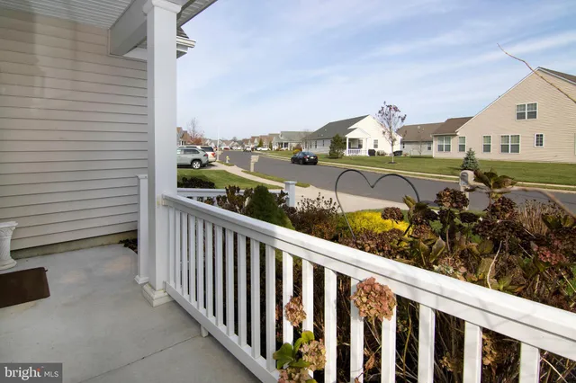 a kitchen that has a sink a table and chair in it