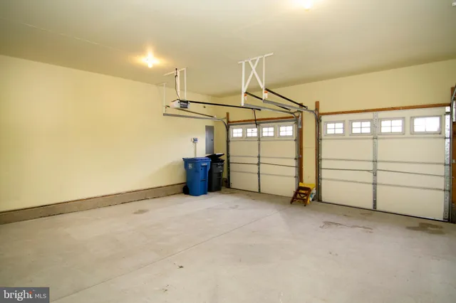 a view of white house with garden