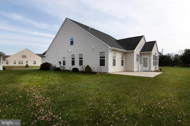 a aerial view of a house with swimming pool and yard