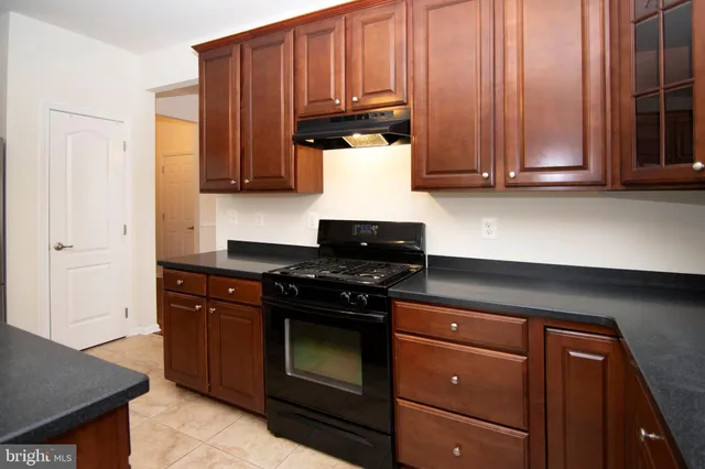 a kitchen with a table and chairs