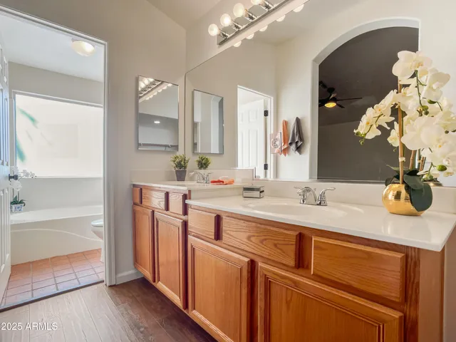 a bath room with a toilet and a bath tub
