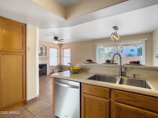 a kitchen with a sink stove and microwave