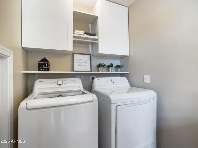 a view of swimming pool with outdoor seating and green space