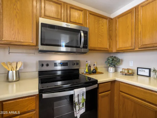 a kitchen with a stove and a microwave