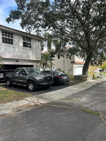 a view of a car parked in front of a house