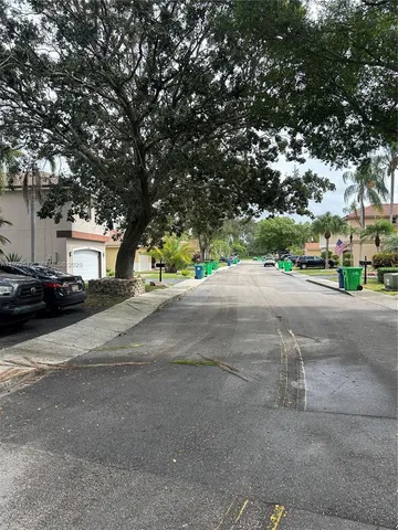 a view of street with houses and trees