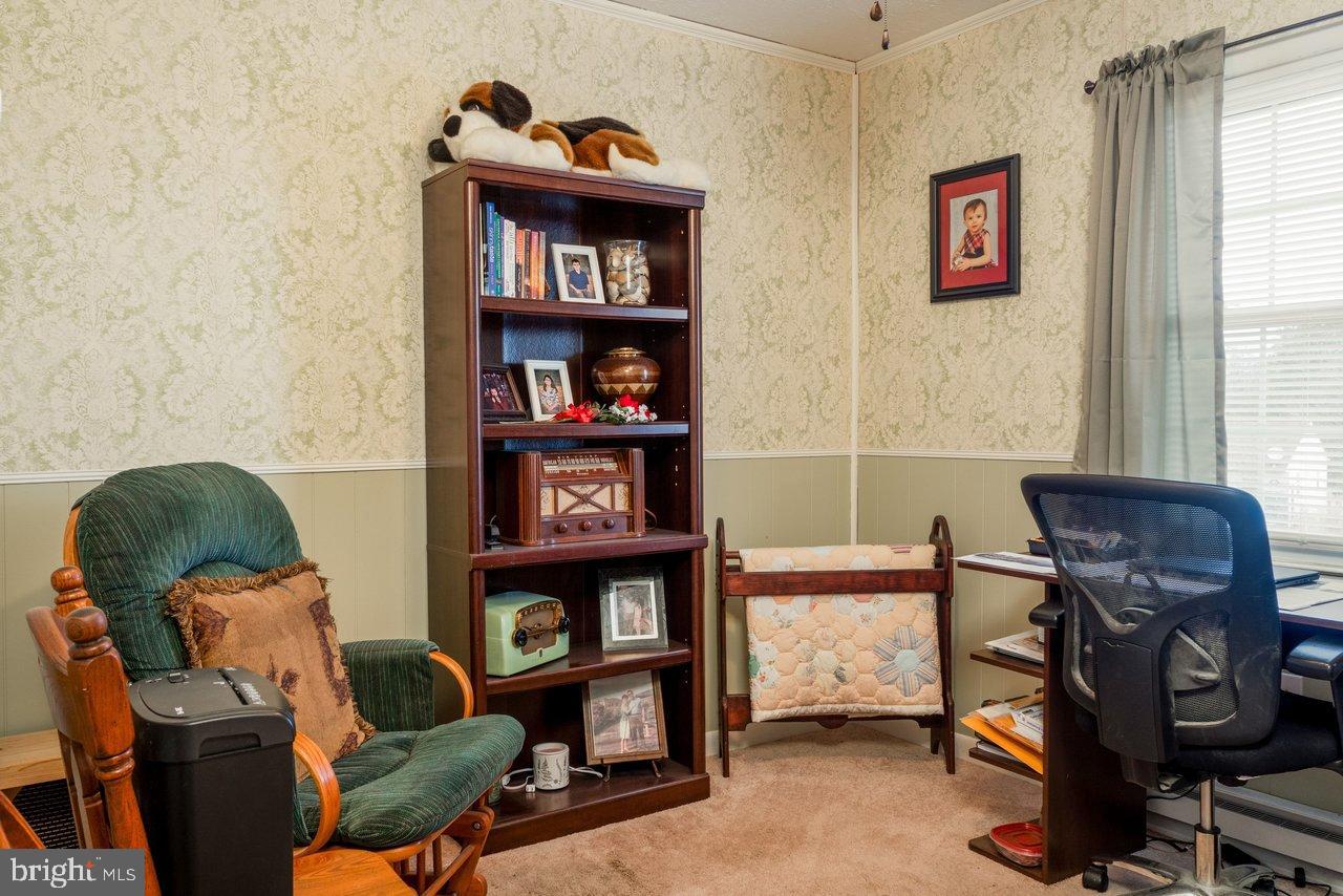 1204 Battle Creek Road Stanley, VA 22851 - Photo 25 of 46 a living room with furniture and a window