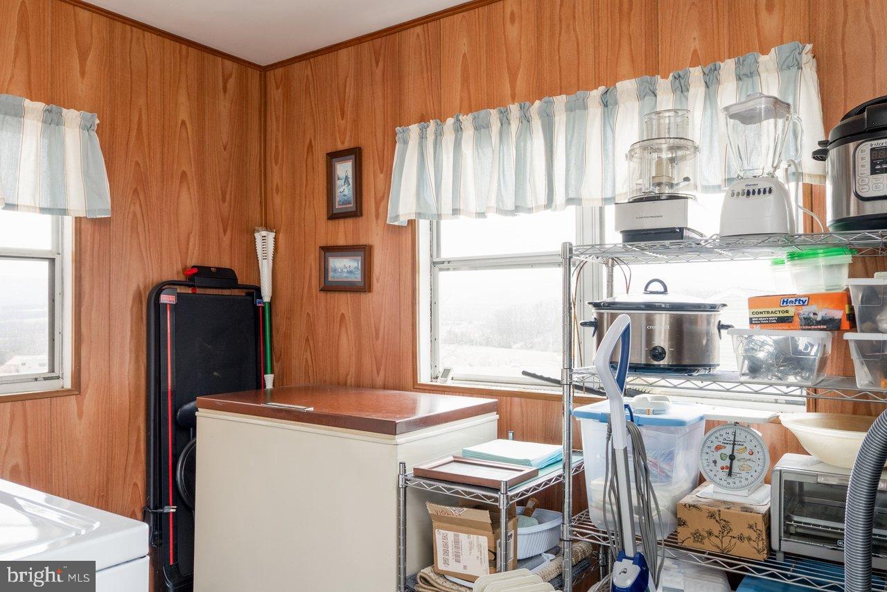 1204 Battle Creek Road Stanley, VA 22851 - Photo 29 of 46 a kitchen with stainless steel appliances a refrigerator and a stove top oven