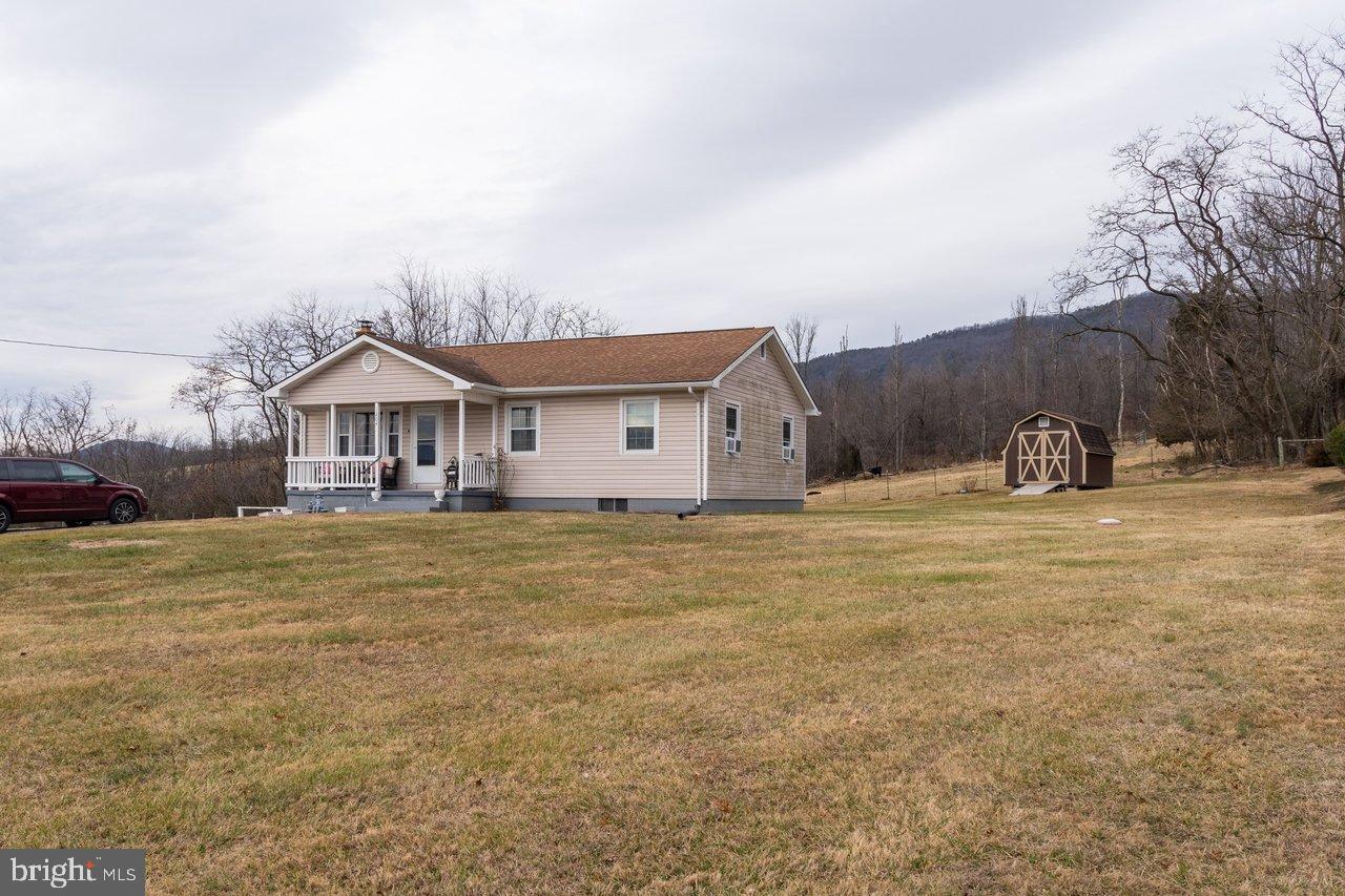 1204 Battle Creek Road Stanley, VA 22851 - Photo 3 of 46 a front view of a house with a yard