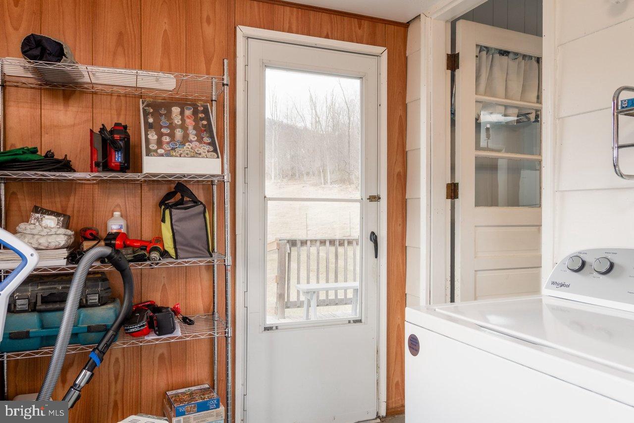 1204 Battle Creek Road Stanley, VA 22851 - Photo 31 of 46 a view of walk in closet with clothes and shoes
