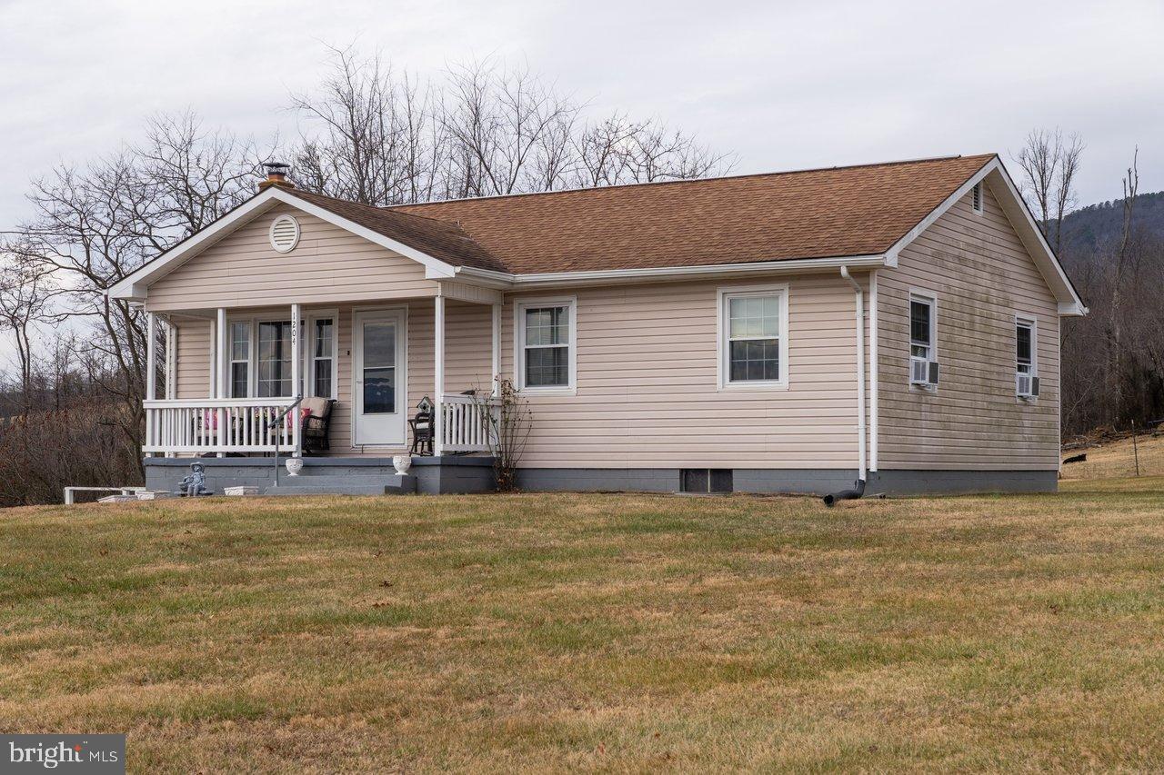 1204 Battle Creek Road Stanley, VA 22851 - Photo 43 of 46 a view of a house with swimming pool and porch