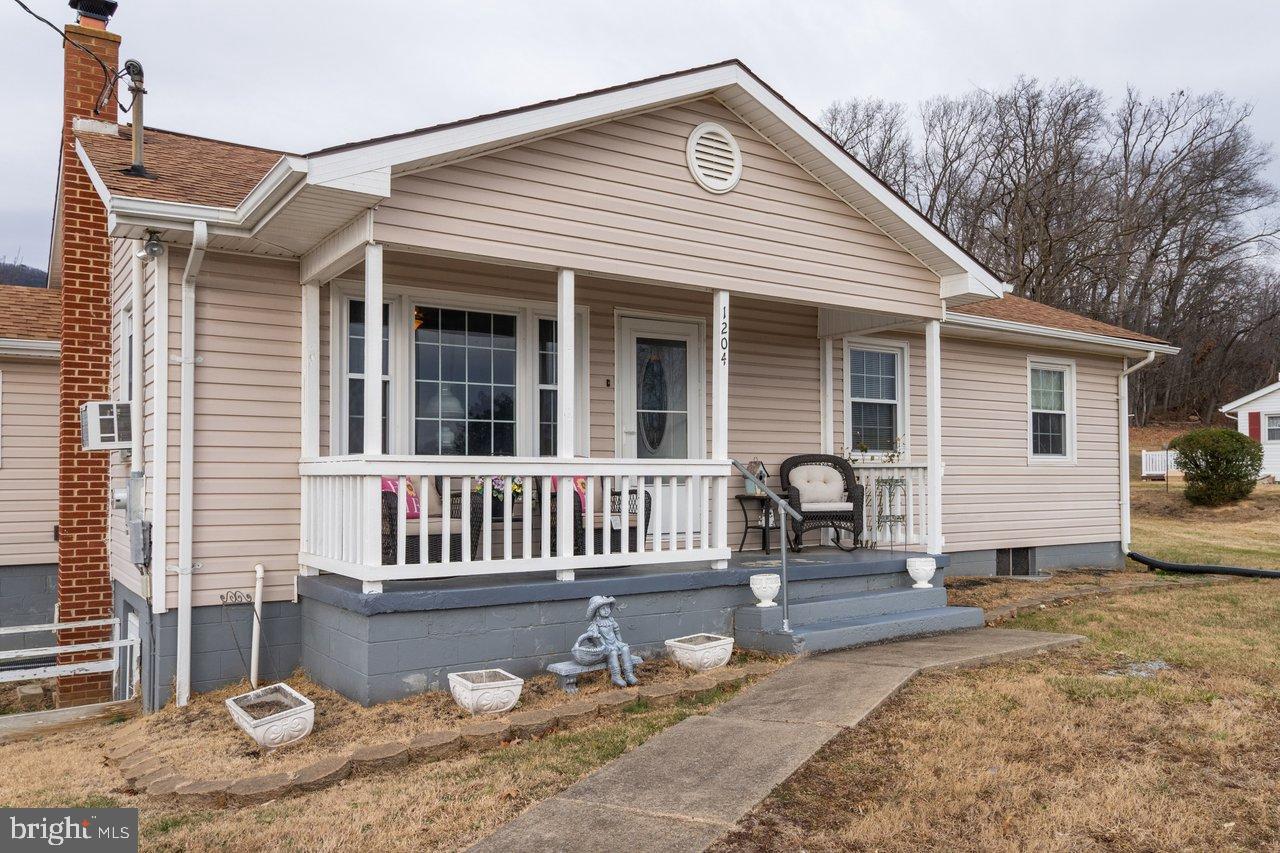 1204 Battle Creek Road Stanley, VA 22851 - Photo 45 of 46 a front view of a house with a yard