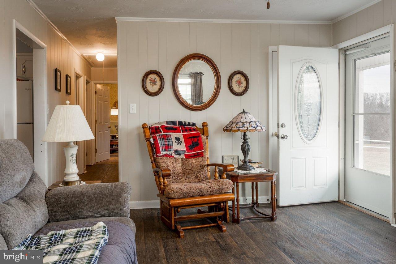 1204 Battle Creek Road Stanley, VA 22851 - Photo 9 of 46 a living room with furniture and a wooden floor