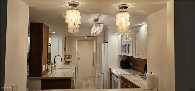 a bathroom with a sink toilet a mirror and shower