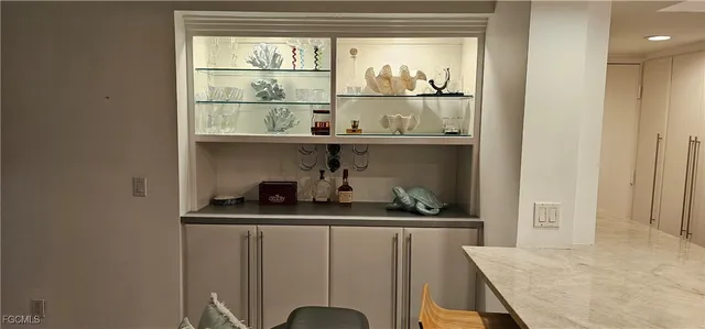 a kitchen with a sink and a refrigerator