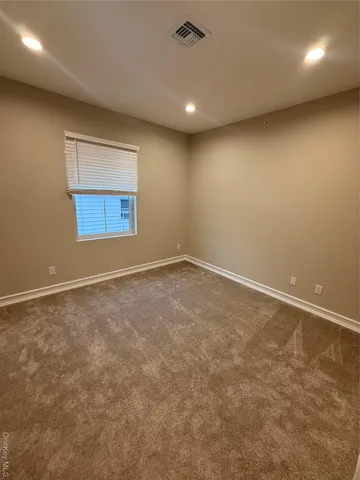 an empty room with a empty space and a window