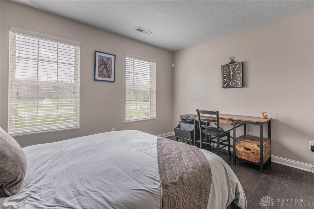 407 Brownstone Row Springboro, OH 45066 - Photo 41 of 54 This spacious bedroom offers ample natural light.