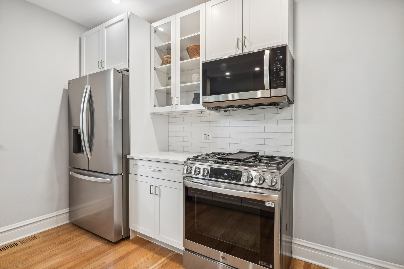 2429 Central Street Evanston, IL 60201 - Photo 13 of 34 a kitchen with stainless steel appliances a stove a microwave and a refrigerator