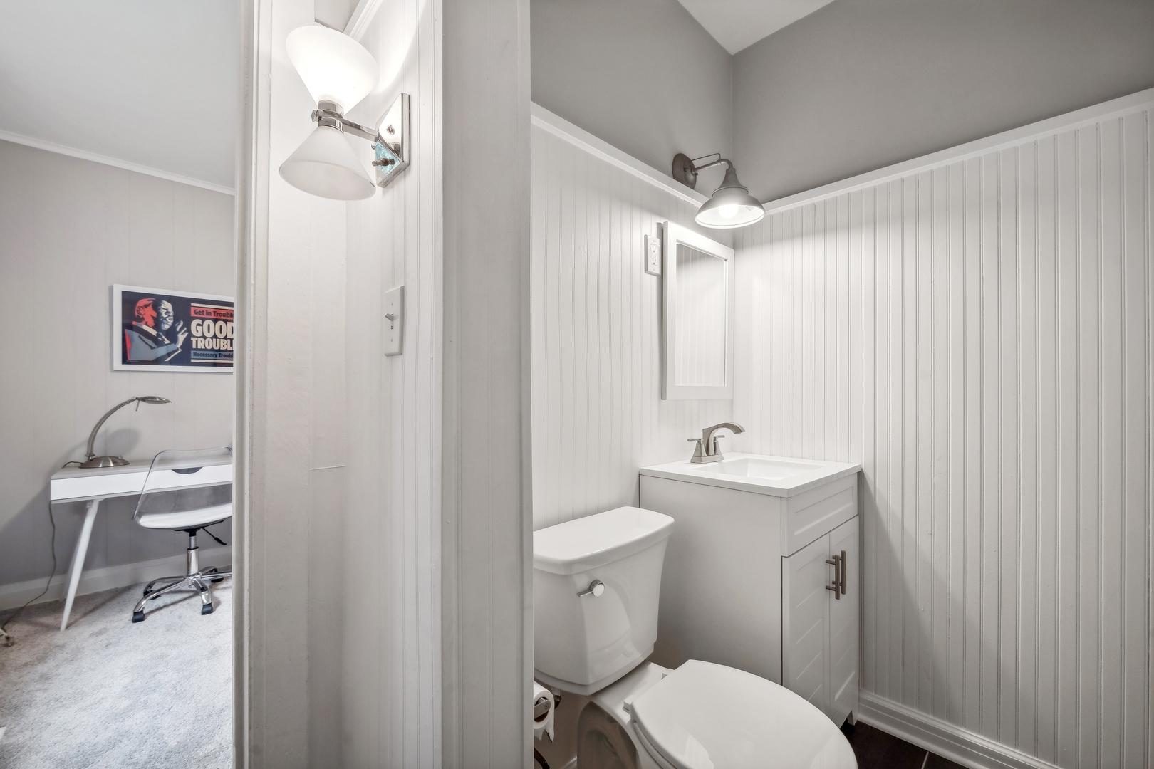 2429 Central Street Evanston, IL 60201 - Photo 17 of 34 a bathroom with a toilet a sink and mirror