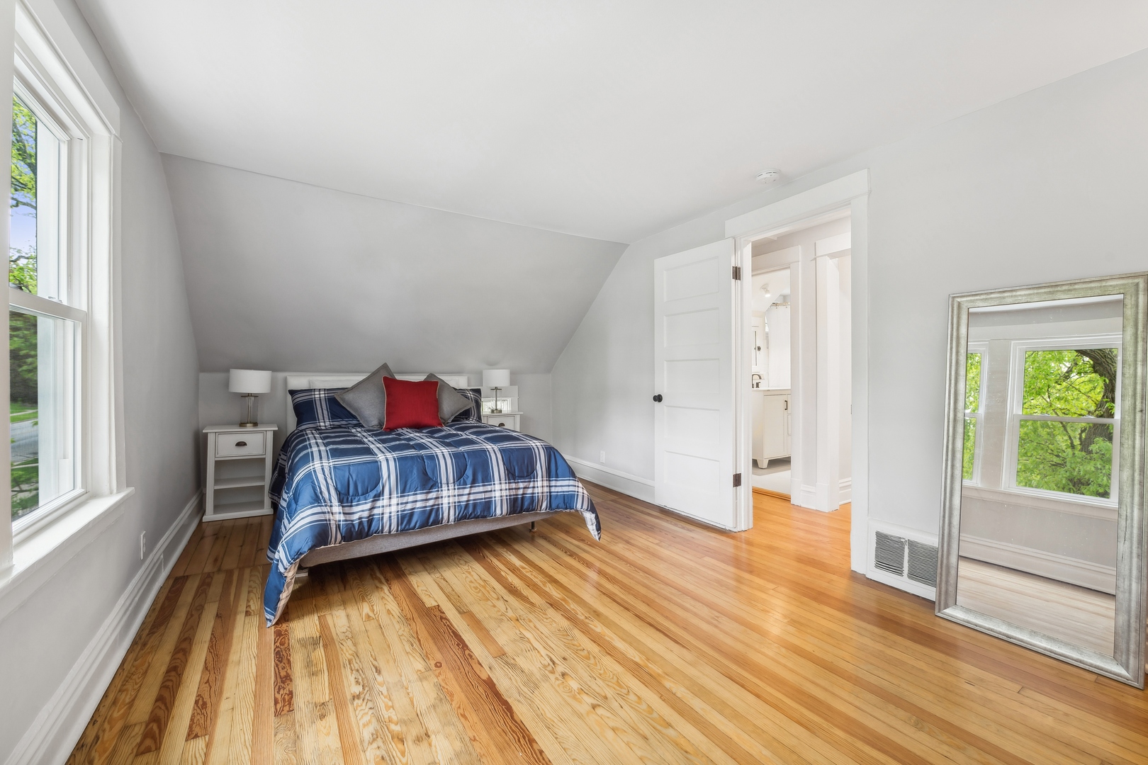 2429 Central Street Evanston, IL 60201 - Photo 19 of 34 a bedroom with a bed and wooden floor
