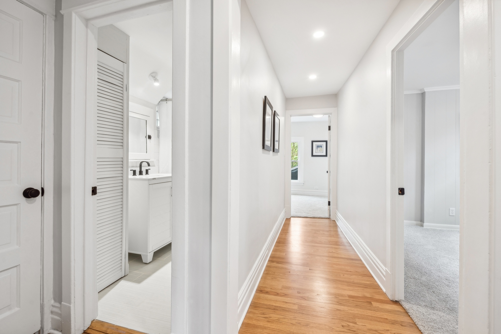 2429 Central Street Evanston, IL 60201 - Photo 23 of 34 a view of a hallway with wooden floor and a bathroom