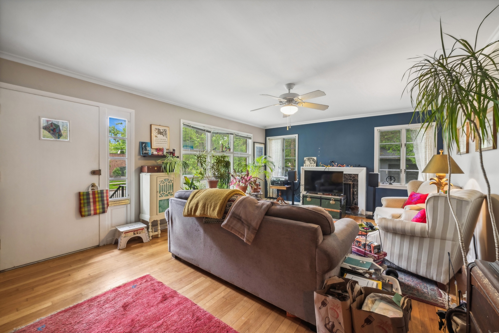 2429 Central Street Evanston, IL 60201 - Photo 27 of 34 a living room with furniture and a fireplace