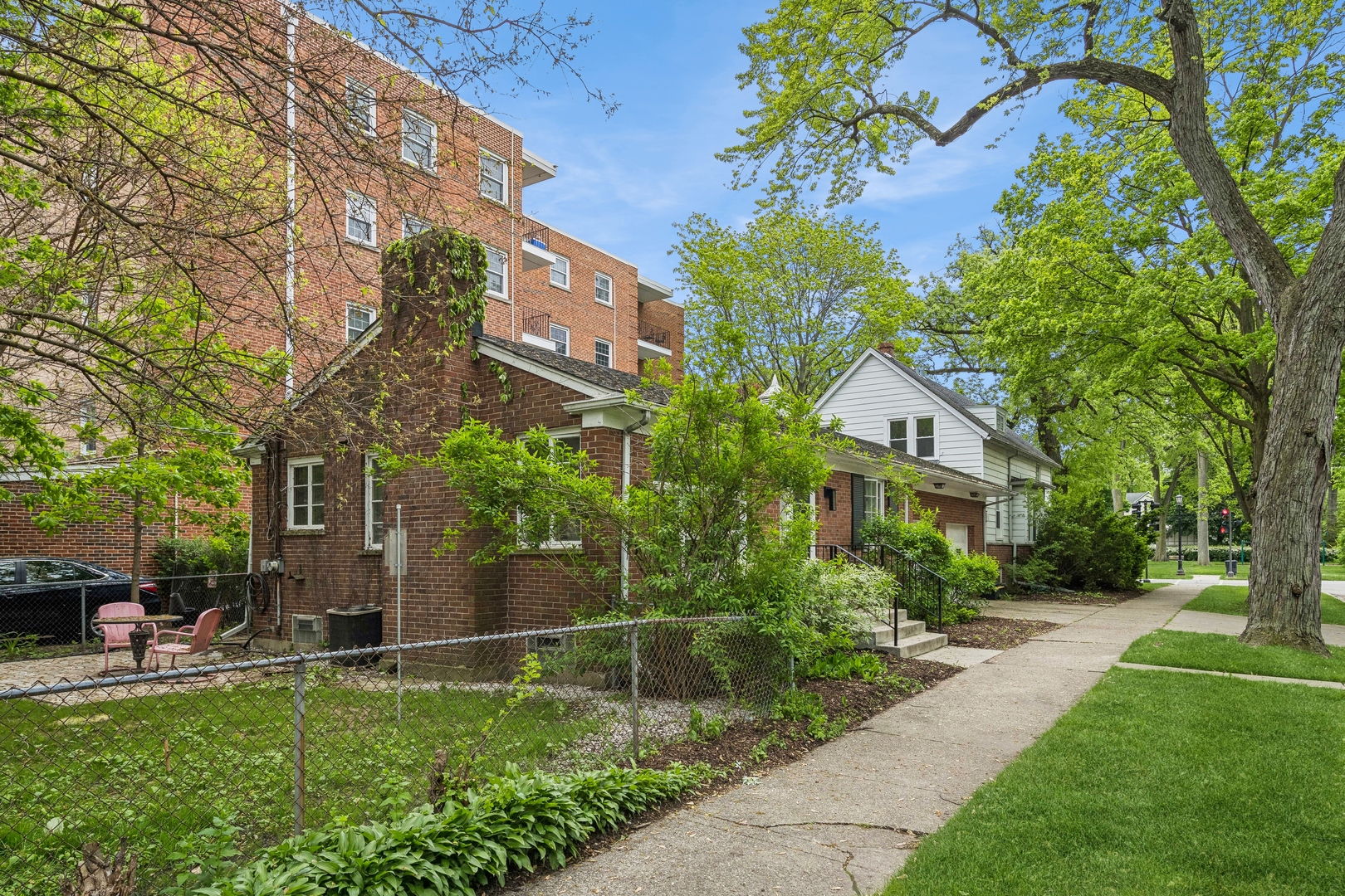 2429 Central Street Evanston, IL 60201 - Photo 3 of 34 a front view of a house with a garden