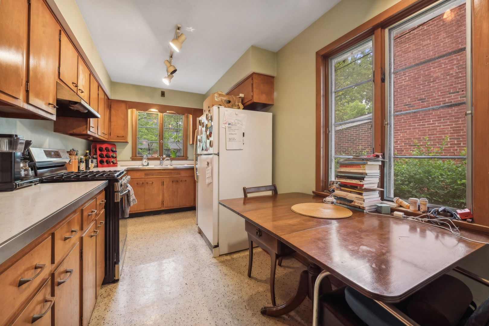 2429 Central Street Evanston, IL 60201 - Photo 33 of 34 a kitchen with stainless steel appliances granite countertop a sink a stove and a refrigerator