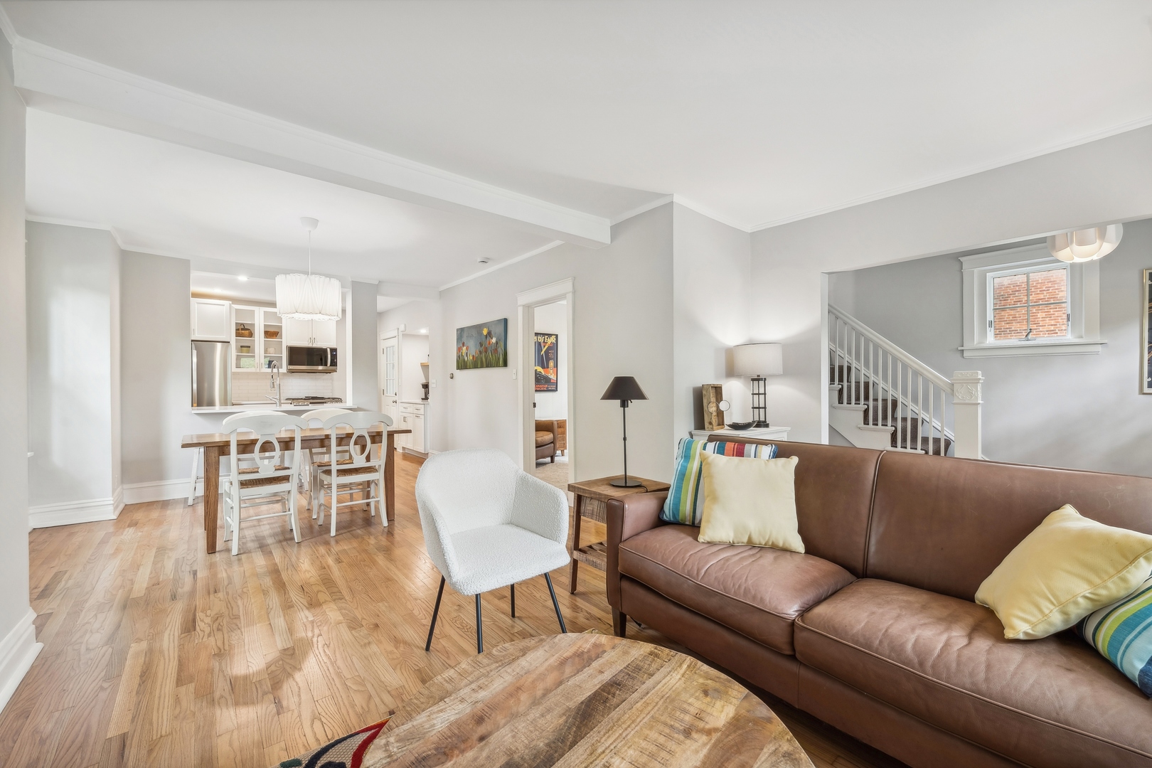 2429 Central Street Evanston, IL 60201 - Photo 9 of 34 a living room with furniture wooden floor and a kitchen