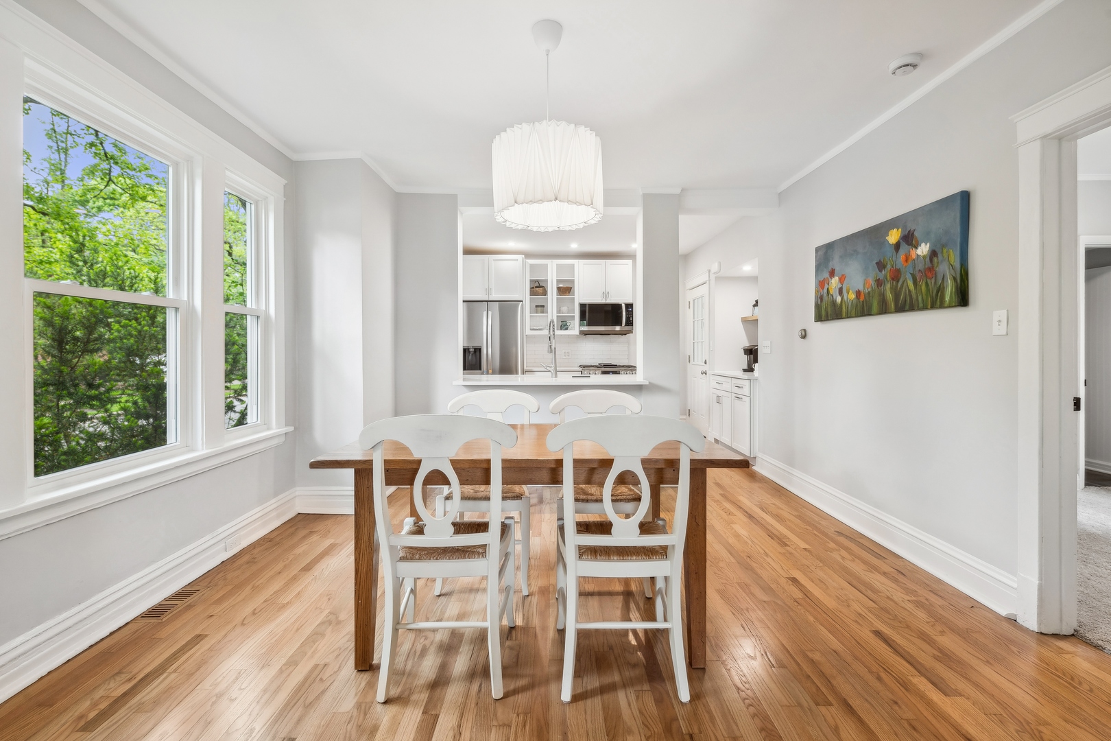 2429 Central Street Evanston, IL 60201 - Photo 10 of 34 a view of a dining room with furniture window and wooden floor