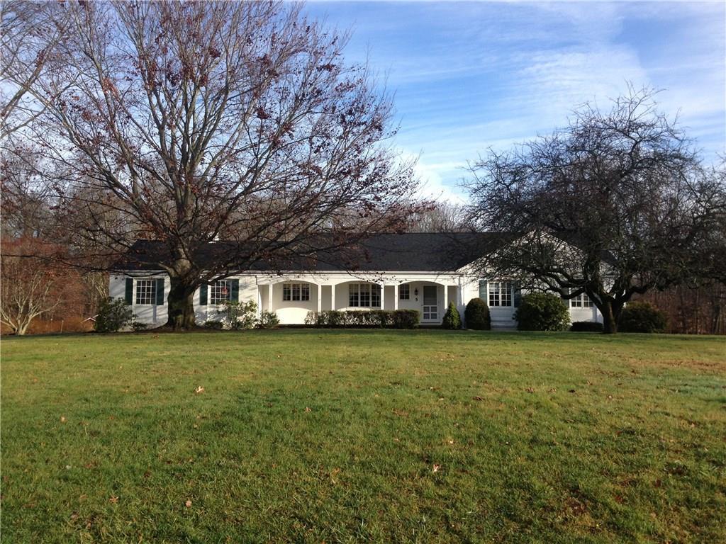 5 Brookhills Road Branford, CT 06405 - Photo 1 of 1 a front view of a house with a garden and trees