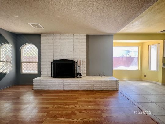250 Peg Street Ridgecrest, CA 93555 - Photo 6 of 16 a spacious bedroom with a bed and window