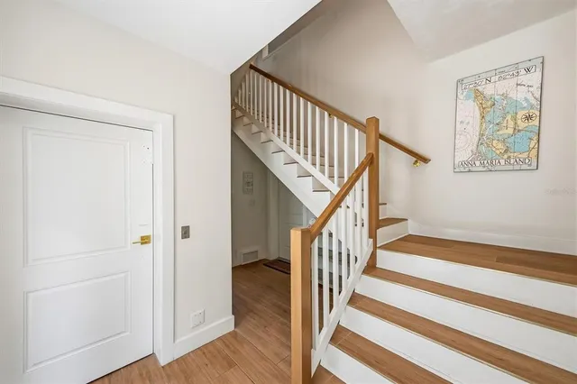 a large white kitchen with a large window