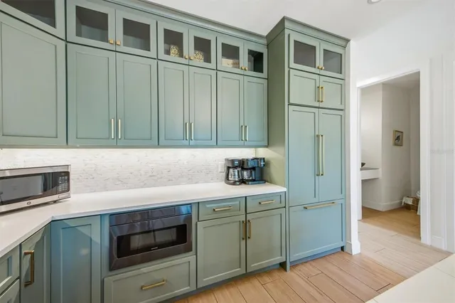 a view of swimming pool with a lounge chairs