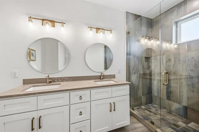 an aerial view of multiple houses with yard