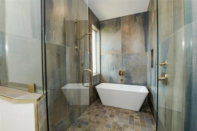 a view of a backyard with a sitting area