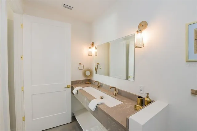 a view of balcony with plants and wooden fence