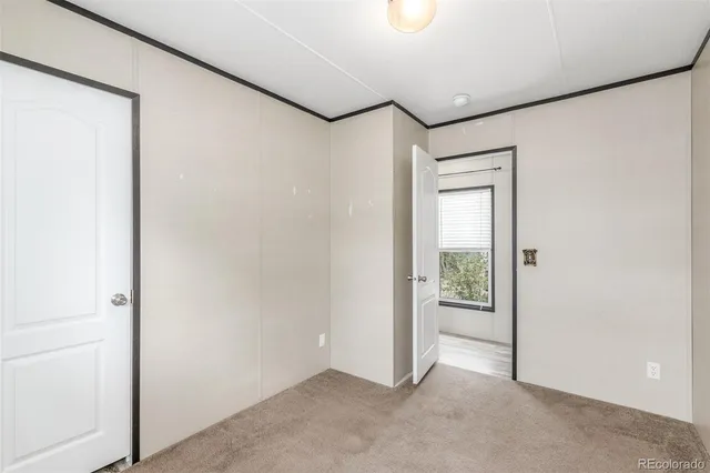 a bathroom with a granite countertop bathtub shower sink vanity and toilet