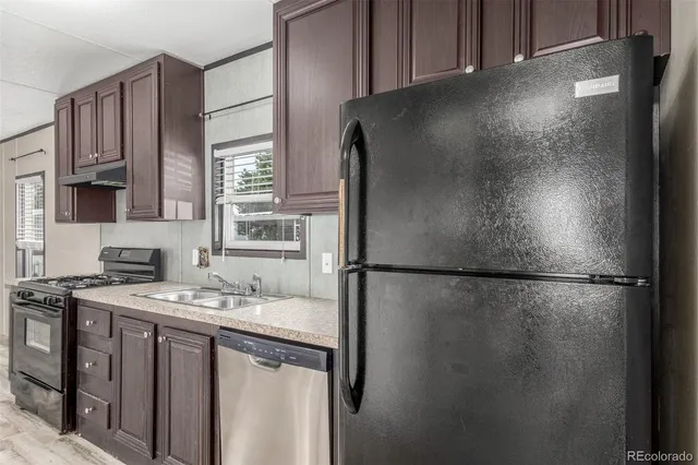 a close view of a refrigerator a stove and a refrigerator