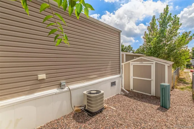a row of palm trees in front of a house
