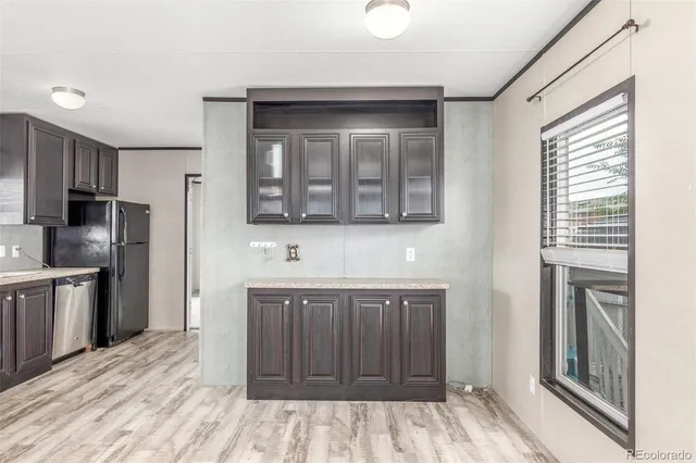 a kitchen with stainless steel appliances granite countertop a stove and a refrigerator