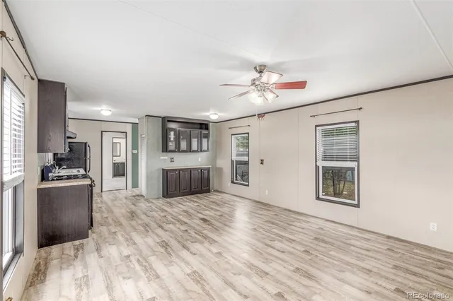 a view of a kitchen with a stove cabinets and wooden floor