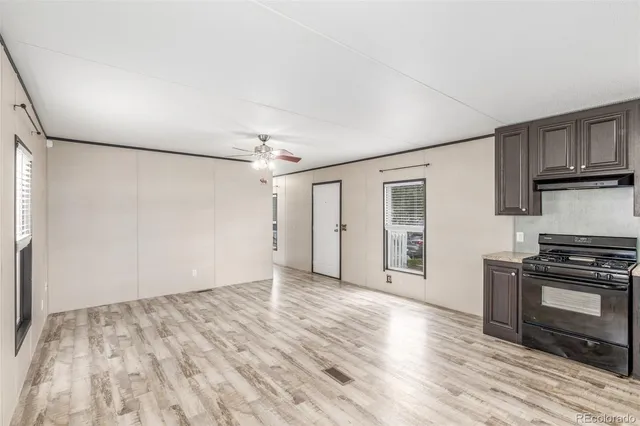 a view of a kitchen with a stove cabinets and wooden floor